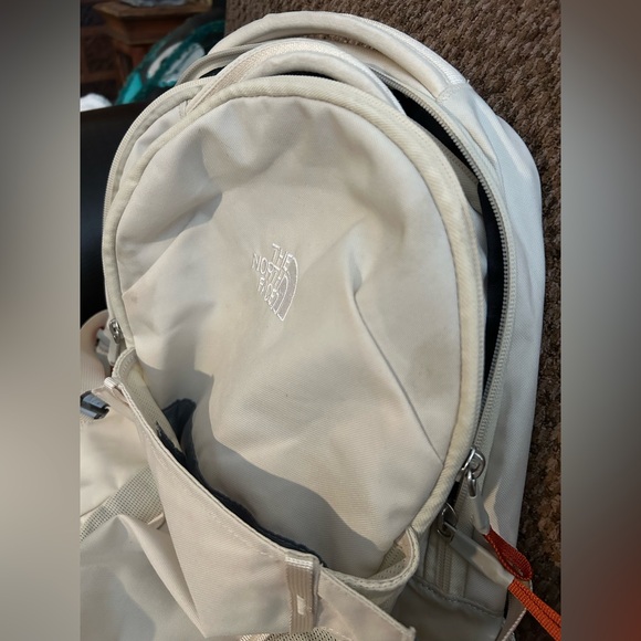 The North Face Cream Backpack with Orange Zipper Pulls
